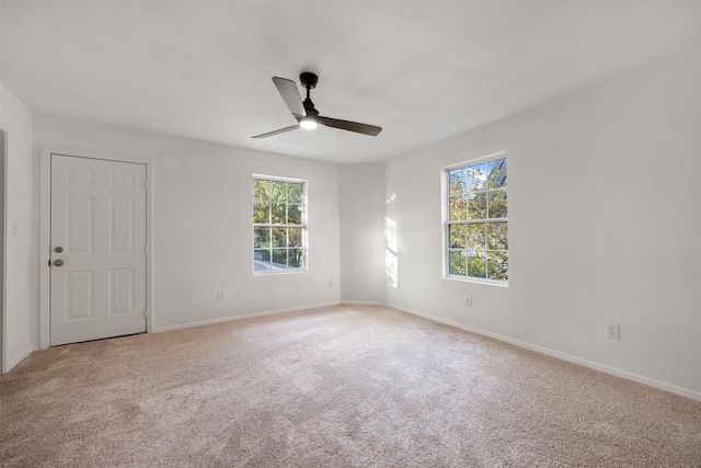 carpeted empty room with ceiling fan