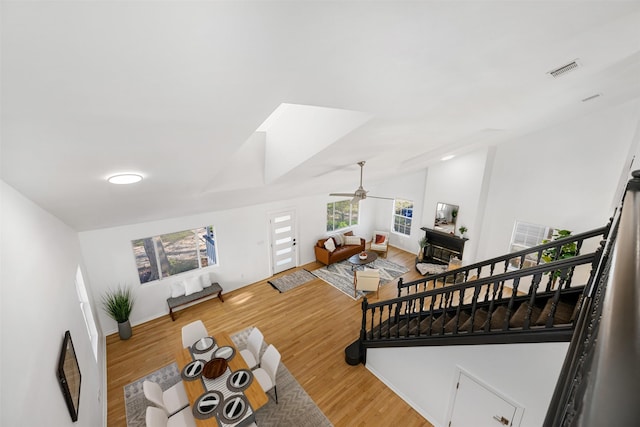 living room featuring ceiling fan and hardwood / wood-style floors