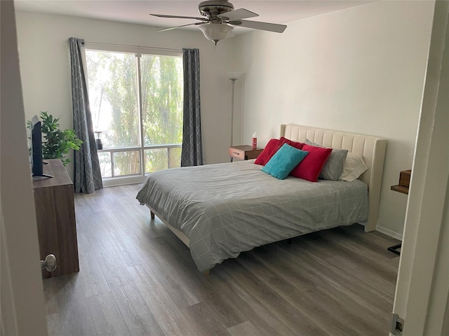 bedroom with ceiling fan and wood-type flooring