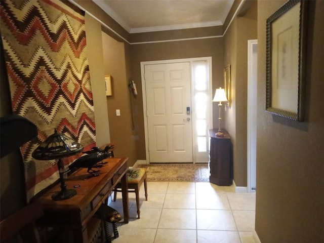 tiled foyer entrance with ornamental molding