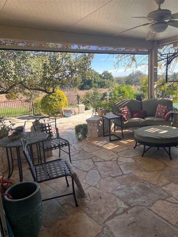 view of patio / terrace with ceiling fan and an outdoor hangout area