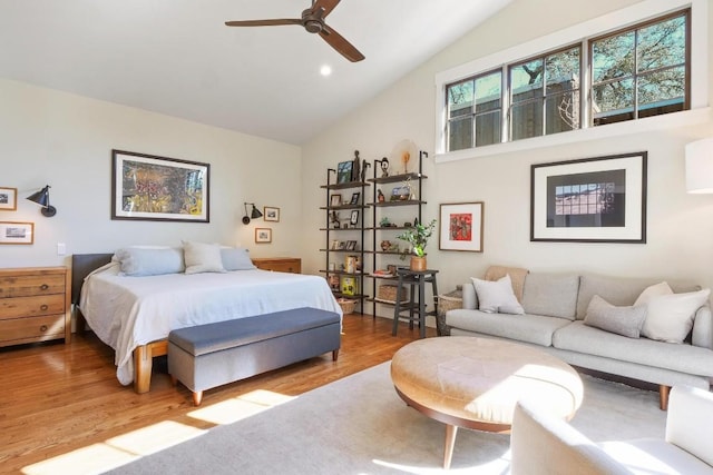 bedroom with lofted ceiling, hardwood / wood-style floors, and ceiling fan