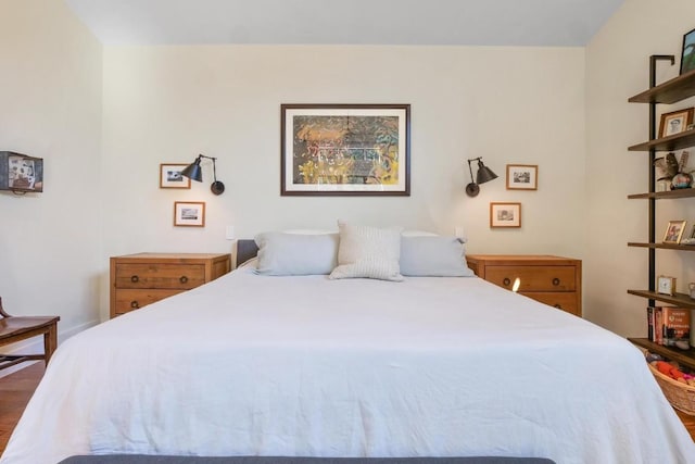 bedroom with hardwood / wood-style floors