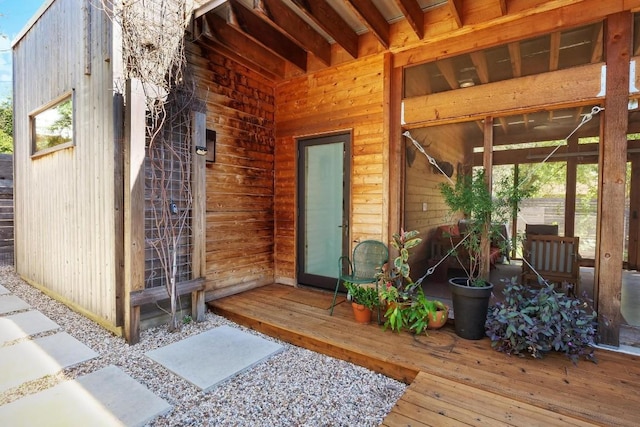 entrance to property with a wooden deck