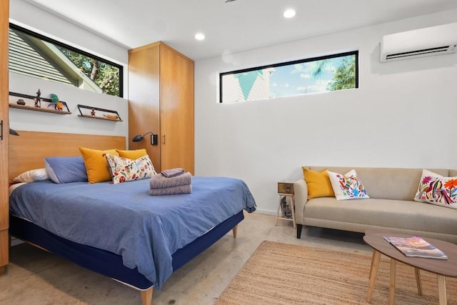 bedroom with multiple windows and an AC wall unit