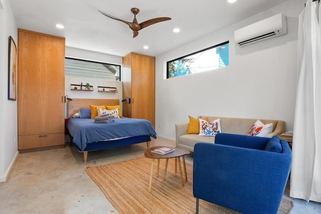 bedroom with ceiling fan and an AC wall unit