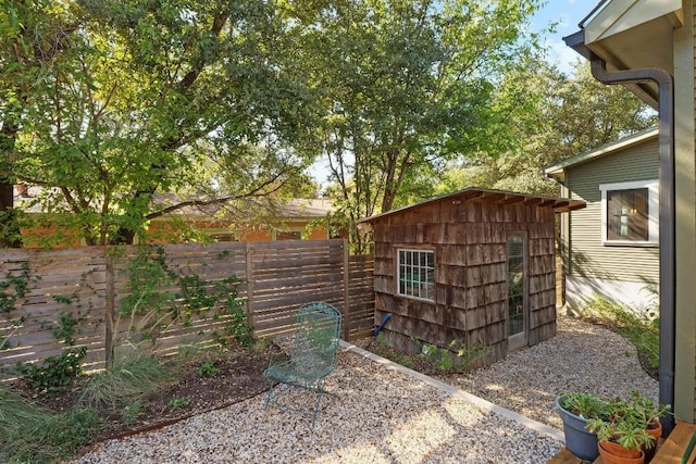view of shed with a fenced backyard
