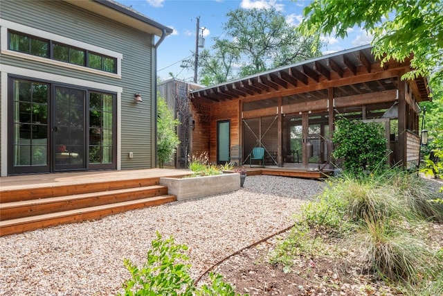 back of house with a wooden deck
