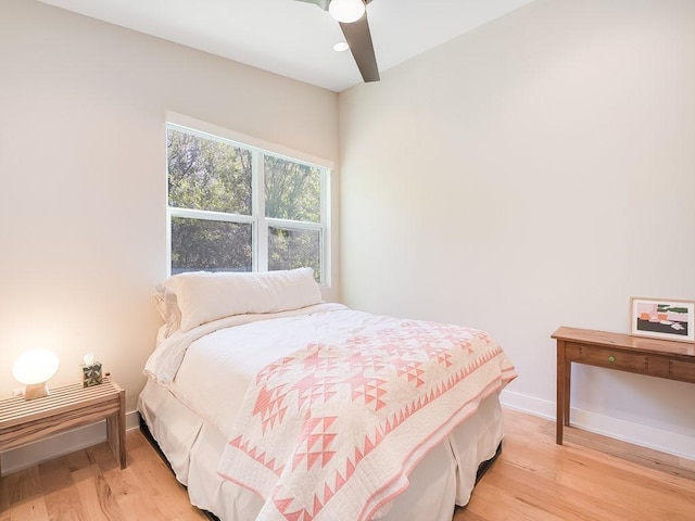 1211 Cometa St Unit B, Austin, TX 78721 - bedroom featuring light wood-style floors, baseboards, and ceiling fan