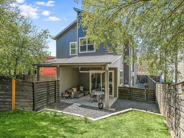 back of property featuring outdoor lounge area and a patio area