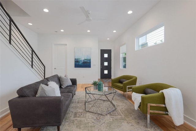1211 Cometa St Unit B, Austin, TX 78721 - living room with wood finished floors, recessed lighting, baseboards, a ceiling fan, and stairs