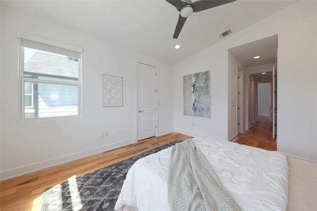1211 Cometa St Unit B, Austin, TX 78721 - bedroom featuring vaulted ceiling, wood finished floors, recessed lighting, ceiling fan, and baseboards