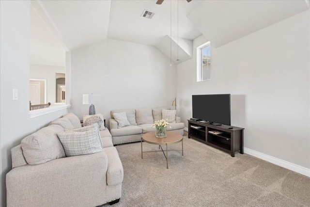 carpeted living room featuring ceiling fan and vaulted ceiling