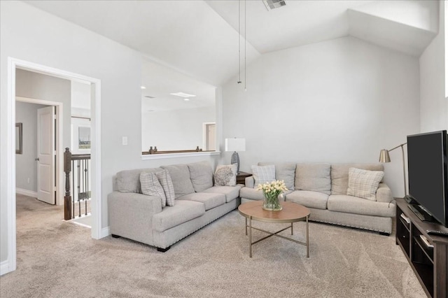 carpeted living room with lofted ceiling