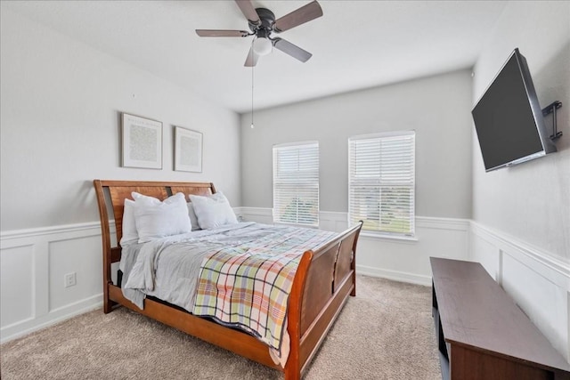 bedroom with light carpet and ceiling fan