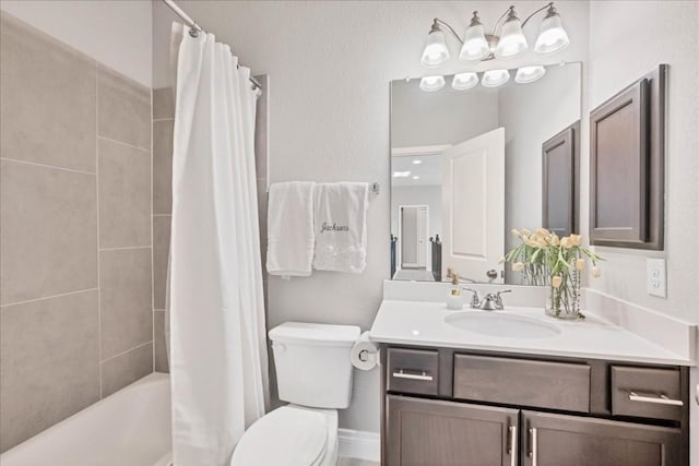 full bathroom featuring toilet, vanity, and shower / bathtub combination with curtain