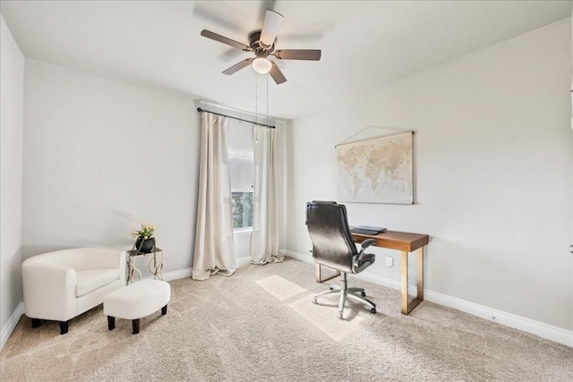 office space with ceiling fan and light colored carpet