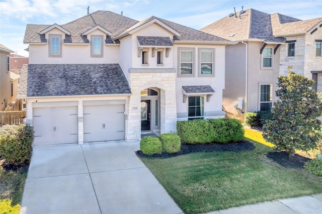 view of front of house featuring a front lawn and a garage