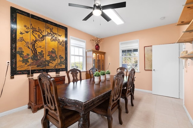 dining area with a wealth of natural light and ceiling fan