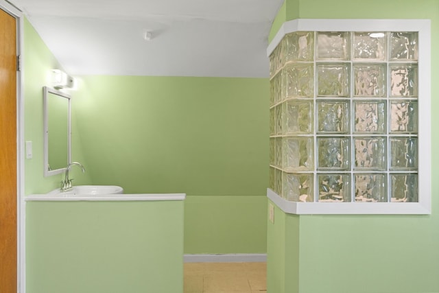 bathroom featuring tile patterned floors and vanity