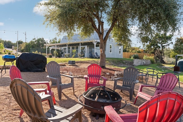 view of patio / terrace featuring grilling area and a fire pit