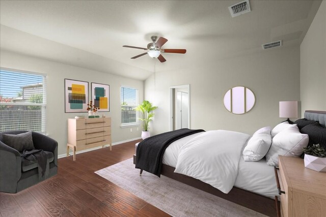 bedroom with multiple windows, ceiling fan, and dark hardwood / wood-style floors