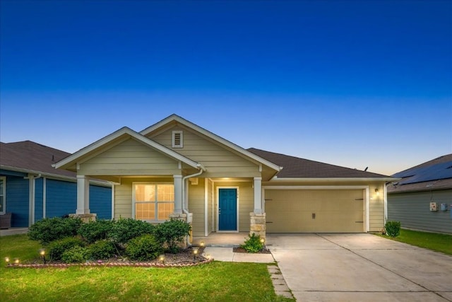 craftsman-style house with covered porch and a garage