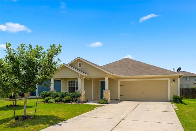 view of front of home featuring a front yard and a garage