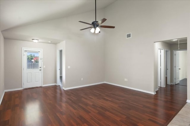 unfurnished living room featuring dark hardwood / wood-style flooring, high vaulted ceiling, and ceiling fan