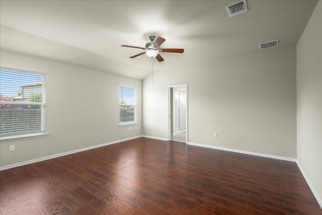 spare room featuring ceiling fan and dark wood-type flooring