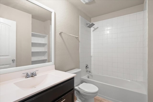 full bathroom featuring vanity, tile patterned floors, tiled shower / bath combo, and toilet