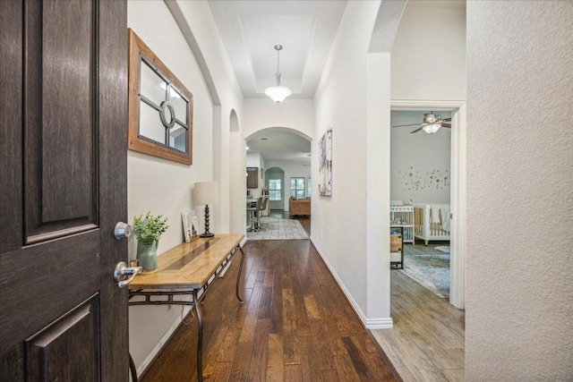 corridor with hardwood / wood-style floors