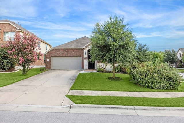 view of front of home featuring a front yard and a garage