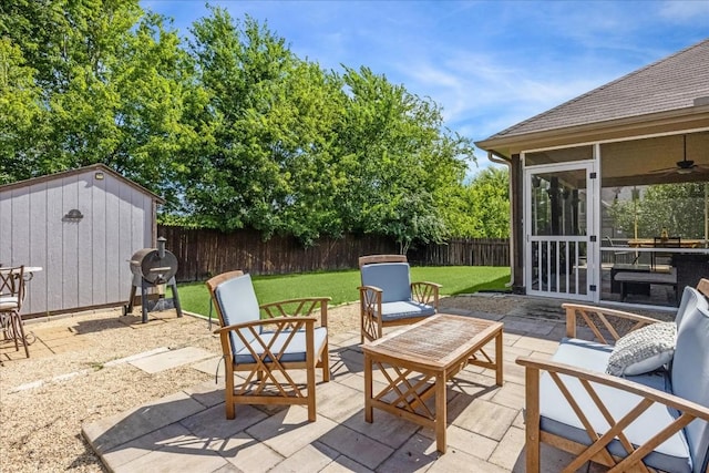 view of patio featuring an outdoor hangout area, a shed, and grilling area