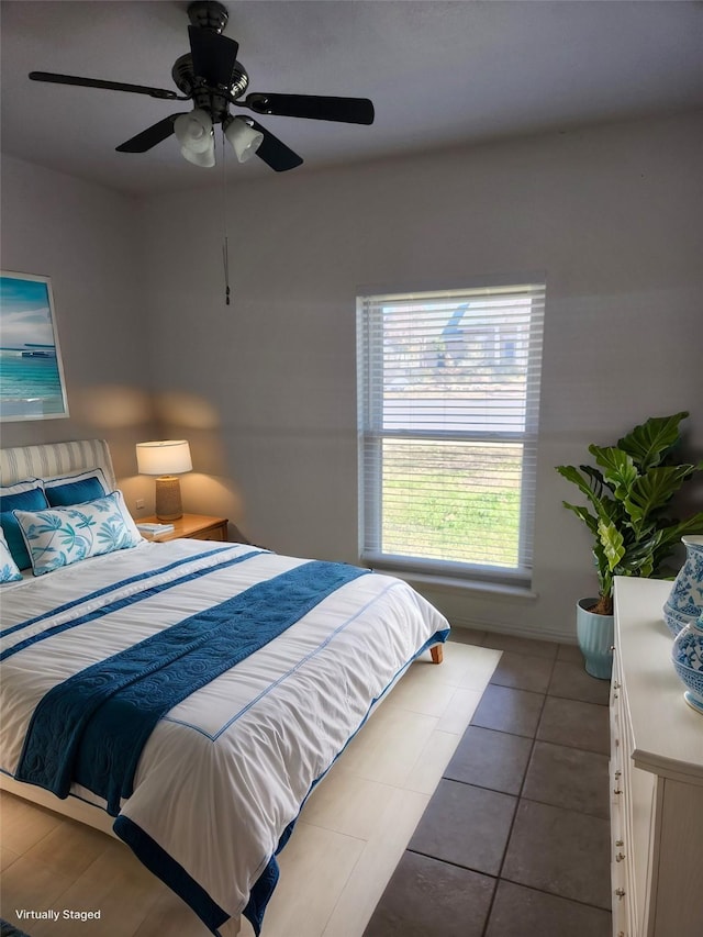 bedroom featuring light tile patterned floors and ceiling fan