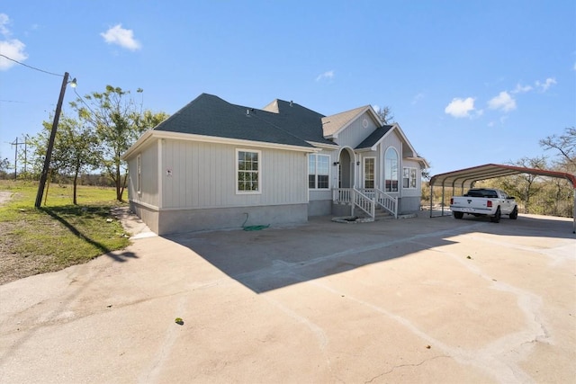 view of front facade with a carport