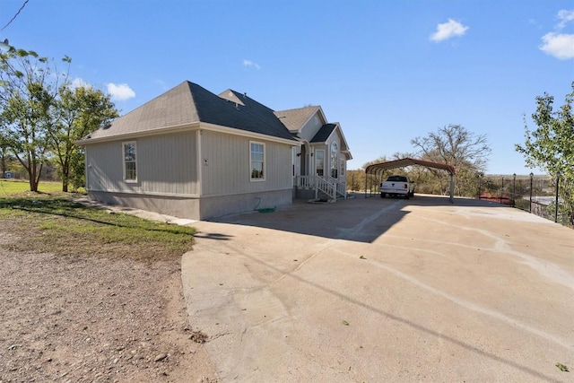 view of property exterior with a carport