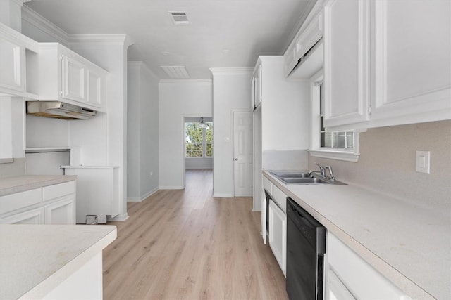 kitchen with sink, black dishwasher, light hardwood / wood-style floors, white cabinets, and ornamental molding