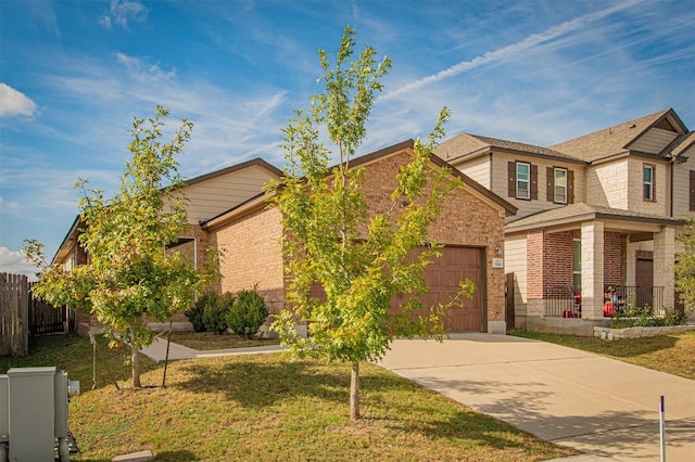 view of front of house featuring a garage and a front lawn