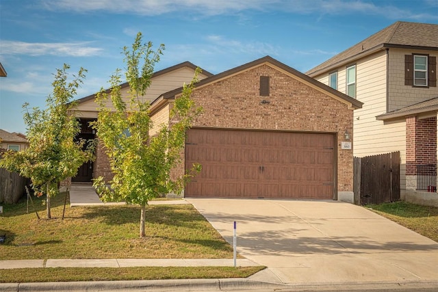 view of front of house with a garage and a front yard