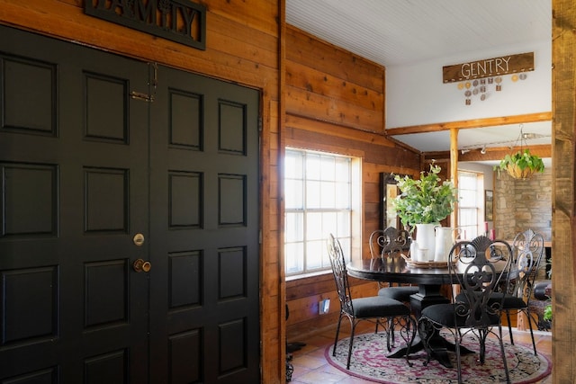 dining area with wooden walls