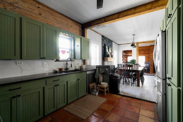 kitchen featuring appliances with stainless steel finishes, sink, beam ceiling, and green cabinets