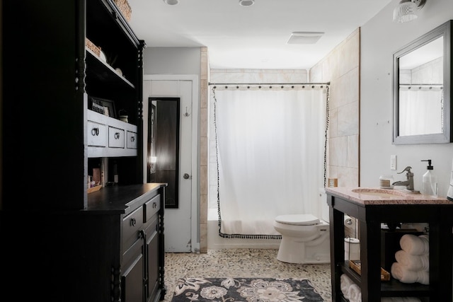 bathroom with vanity and toilet