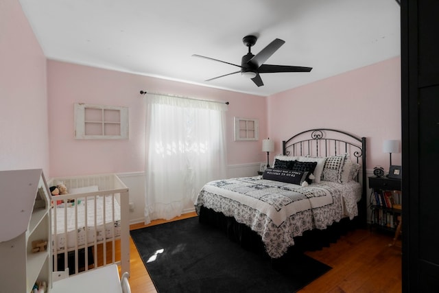 bedroom featuring ceiling fan and wood-type flooring