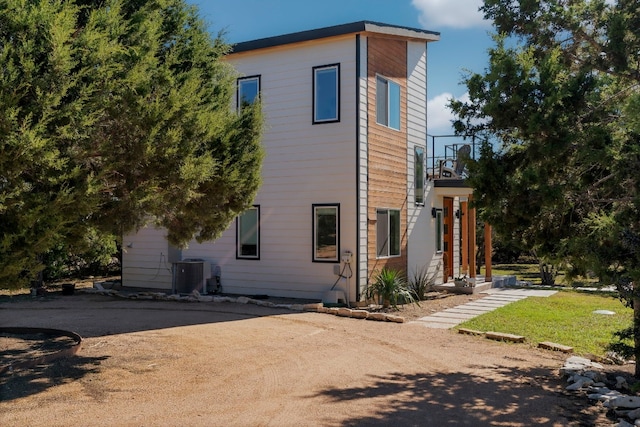 view of property exterior with central air condition unit