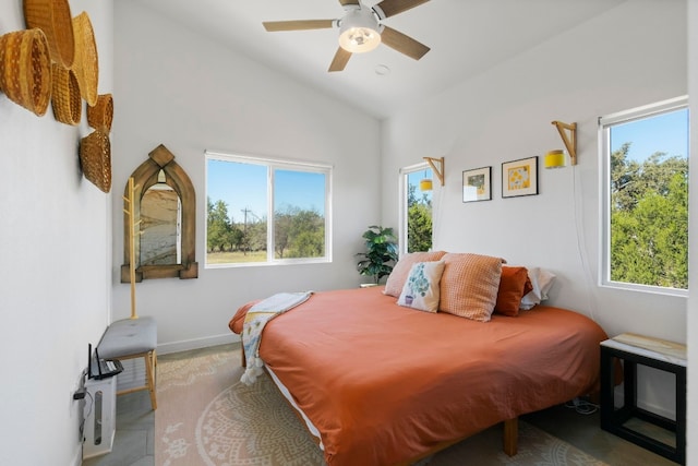 bedroom with multiple windows, vaulted ceiling, and ceiling fan