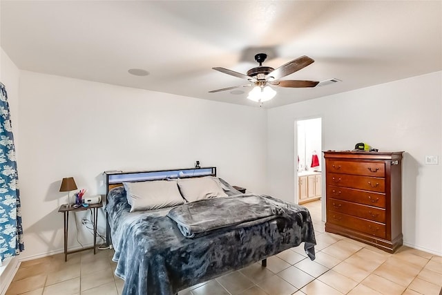 bedroom featuring ensuite bathroom, ceiling fan, and light tile patterned flooring