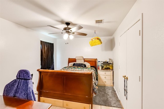 bedroom with light colored carpet and ceiling fan