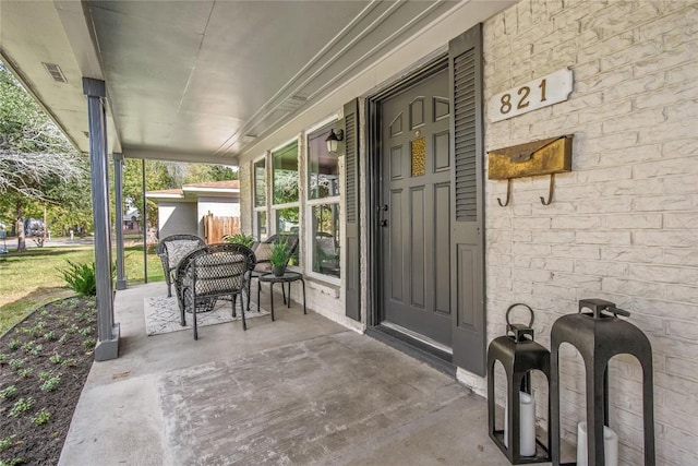 doorway to property with a porch