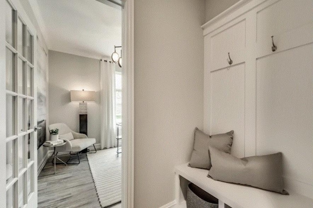 mudroom with light hardwood / wood-style flooring